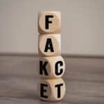 Tower,Made,With,Cubes,And,Dice,With,The,Words,Fake