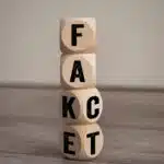 Tower,Made,With,Cubes,And,Dice,With,The,Words,Fake