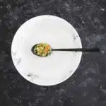 Empty,Plate,With,Lonely,Spoonful,Of,Food,On,It,,Conceptual